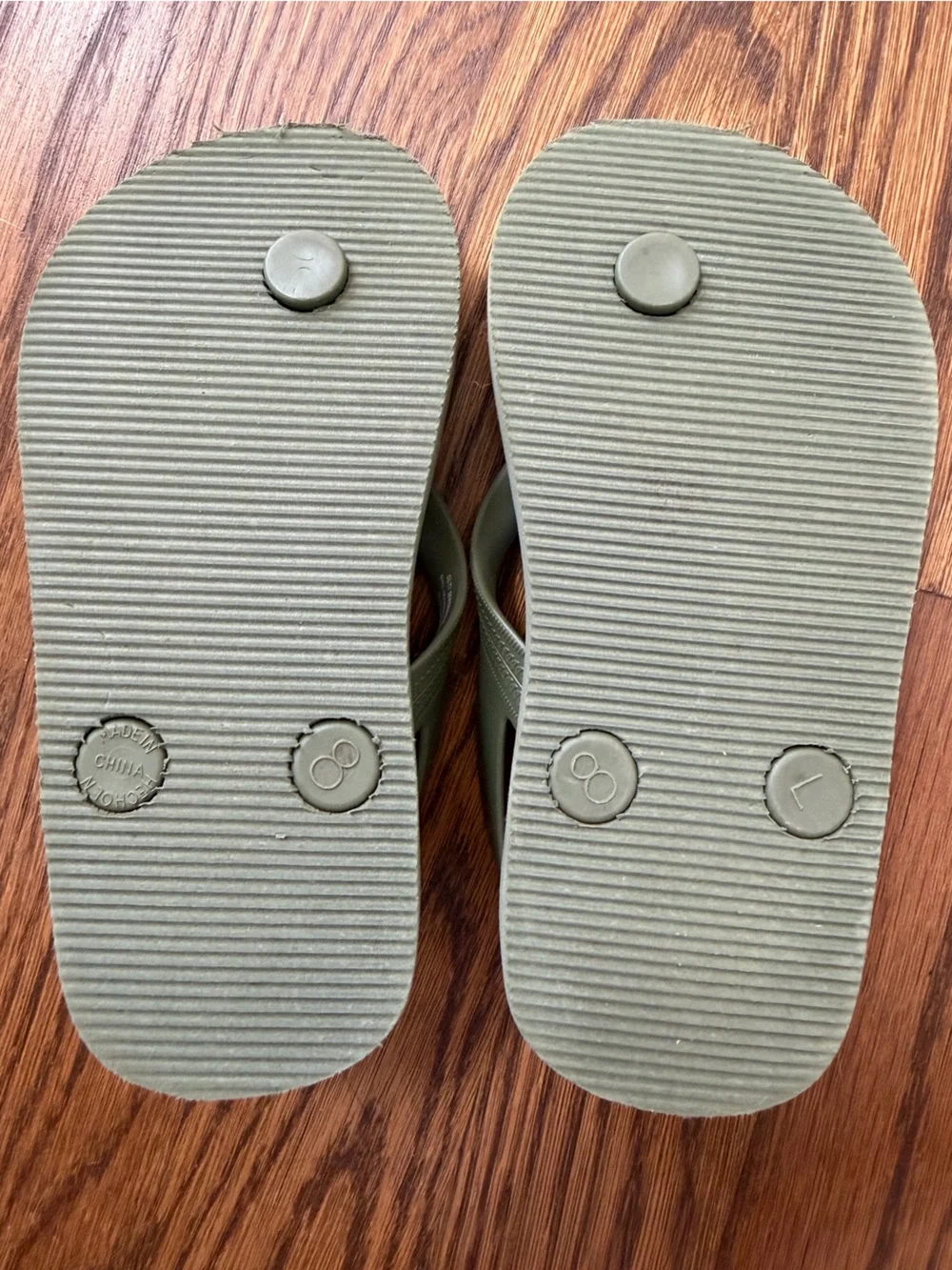 Old Navy olive green flip flops, toddler size 8